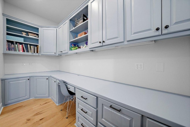 7921 W Rim Dr, Austin, TX 78731 - unfurnished office featuring built in desk and light wood finished floors