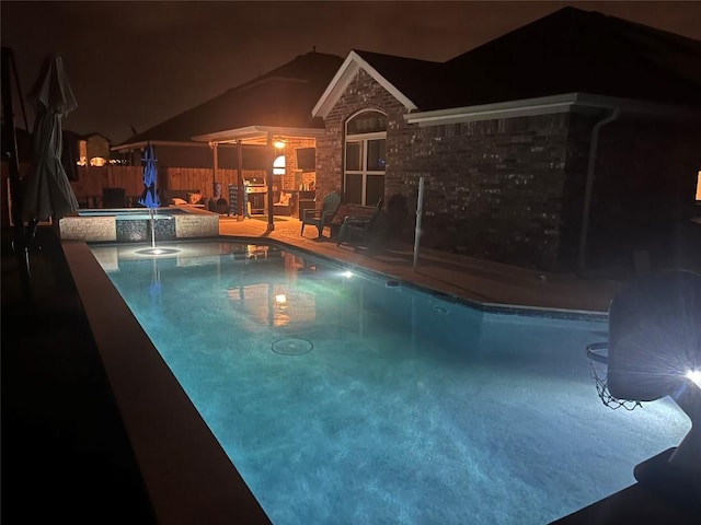 view of swimming pool featuring a fenced in pool, an in ground hot tub, fence, and a patio