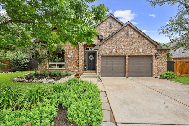 1725 Buttercup Creek Blvd, Cedar Park, TX 78613 - view of front of property featuring a garage, concrete driveway, and brick siding