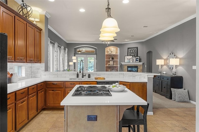 1725 Buttercup Creek Blvd, Cedar Park, TX 78613 - kitchen featuring a sink, stovetop with downdraft, brown cabinetry, recessed lighting, and light countertops