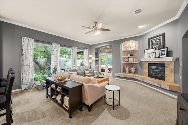 1725 Buttercup Creek Blvd, Cedar Park, TX 78613 - carpeted living area featuring a premium fireplace, a ceiling fan, crown molding, baseboards, and built in shelves