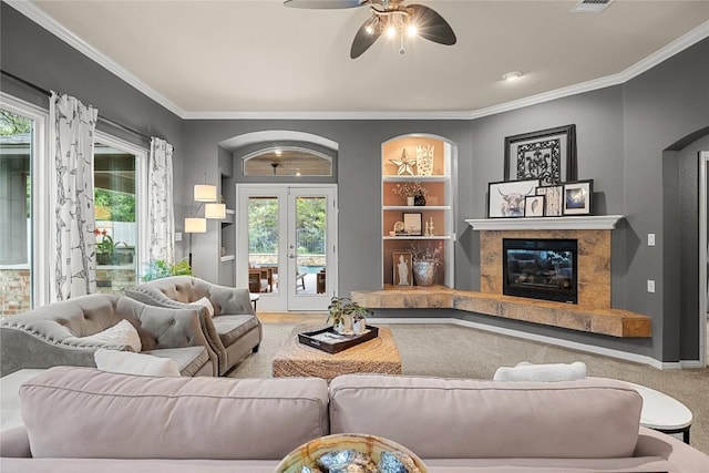 1725 Buttercup Creek Blvd, Cedar Park, TX 78613 - carpeted living room with a ceiling fan, ornamental molding, plenty of natural light, built in shelves, and a fireplace