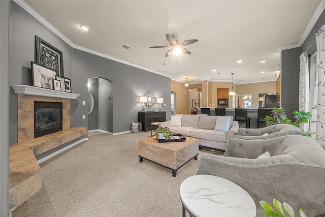 1725 Buttercup Creek Blvd, Cedar Park, TX 78613 - living area with arched walkways, recessed lighting, a ceiling fan, light carpet, and a tile fireplace