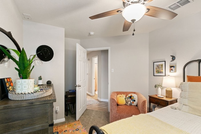 bedroom featuring visible vents, a ceiling fan, and baseboards