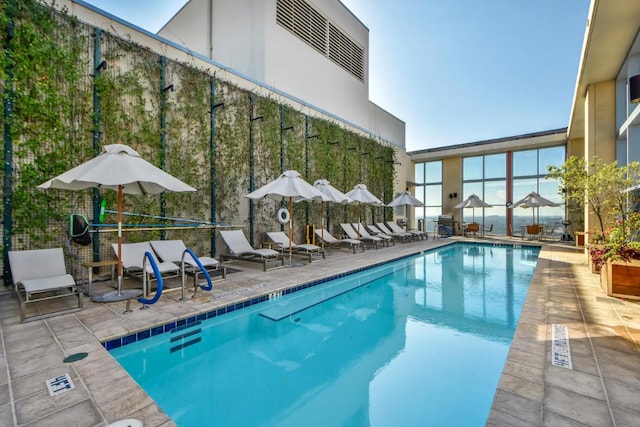 community pool with a patio area