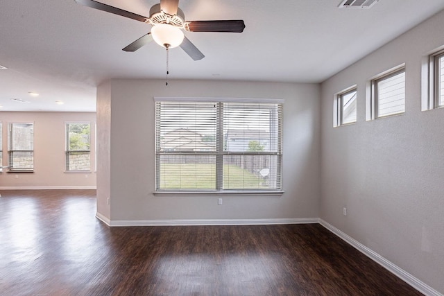 5816 Monmarte Cv, Austin, TX 78744 - spare room featuring plenty of natural light, dark wood finished floors, and baseboards