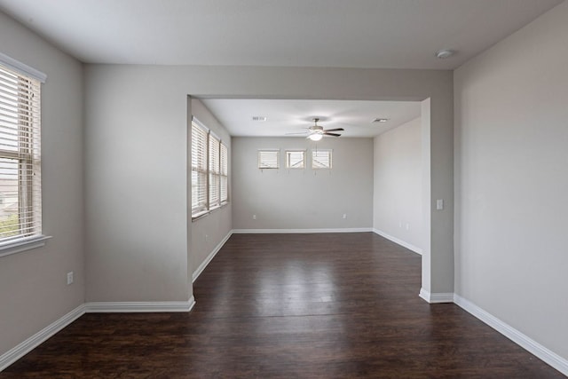 5816 Monmarte Cv, Austin, TX 78744 - spare room featuring plenty of natural light, wood finished floors, a smoke detector, and baseboards