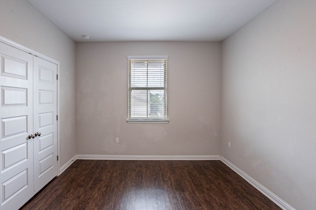 5816 Monmarte Cv, Austin, TX 78744 - unfurnished bedroom with dark wood finished floors and baseboards
