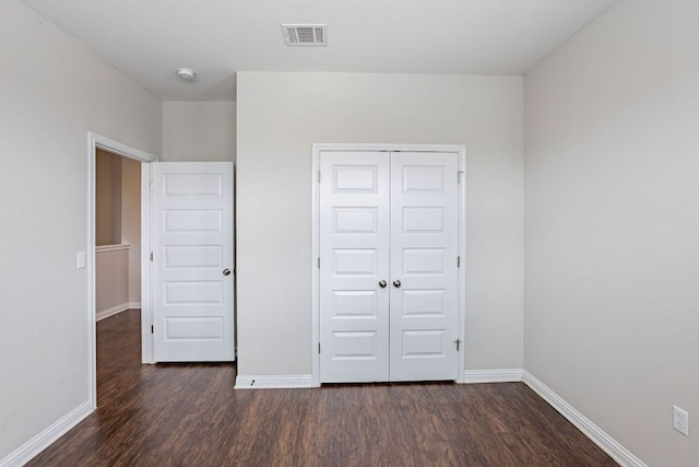 5816 Monmarte Cv, Austin, TX 78744 - unfurnished bedroom featuring wood finished floors, baseboards, and a closet