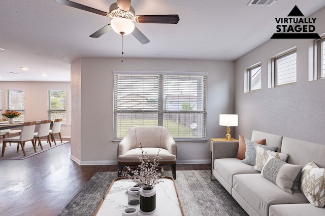 5816 Monmarte Cv, Austin, TX 78744 - living room featuring wood finished floors, a ceiling fan, and baseboards