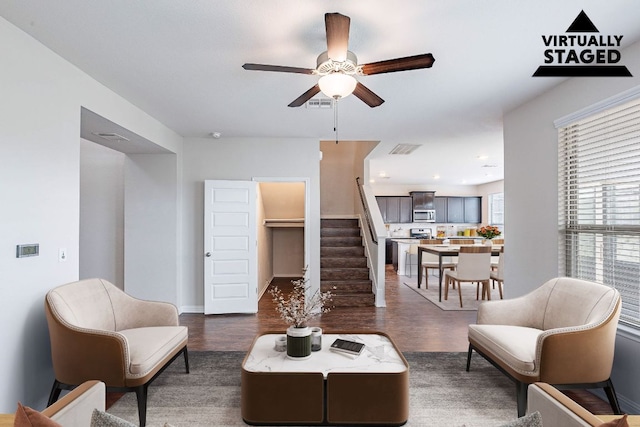 5816 Monmarte Cv, Austin, TX 78744 - living room with stairway, dark wood-style floors, and ceiling fan