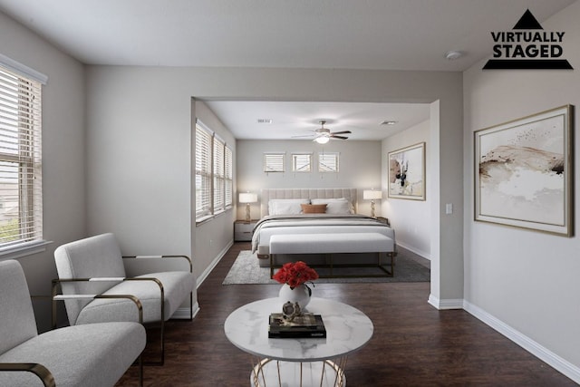 5816 Monmarte Cv, Austin, TX 78744 - bedroom featuring wood finished floors, multiple windows, baseboards, and ceiling fan