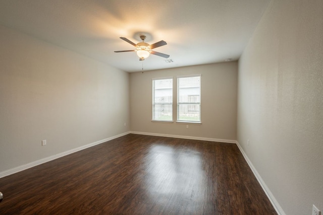 5817 Gerard Dr, Austin, TX 78744 - spare room with ceiling fan, dark wood-style flooring, and baseboards