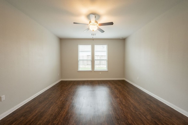 5817 Gerard Dr, Austin, TX 78744 - empty room with a ceiling fan, dark wood-style flooring, and baseboards