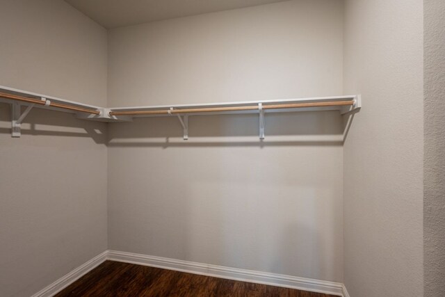 5817 Gerard Dr, Austin, TX 78744 - spacious closet featuring dark wood-type flooring