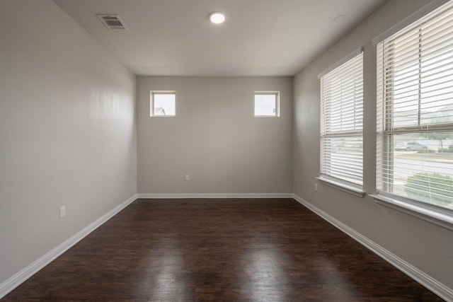 5817 Gerard Dr, Austin, TX 78744 - unfurnished room featuring dark wood-style floors and baseboards