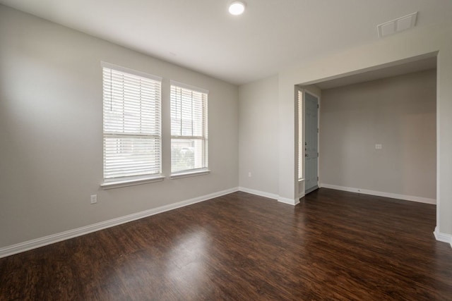 5817 Gerard Dr, Austin, TX 78744 - spare room with dark wood-style floors and baseboards