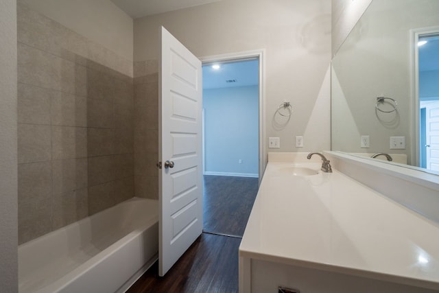 5817 Gerard Dr, Austin, TX 78744 - full bathroom featuring wood finished floors and vanity