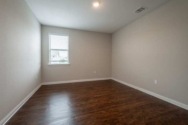 5817 Gerard Dr, Austin, TX 78744 - unfurnished room with dark wood-style floors and baseboards