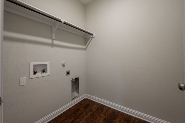 5817 Gerard Dr, Austin, TX 78744 - laundry area featuring electric dryer hookup, dark wood-type flooring, hookup for a washing machine, and baseboards