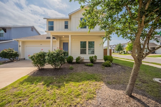 5817 Gerard Dr, Austin, TX 78744 - traditional-style house with board and batten siding, an attached garage, driveway, a front yard, and a porch