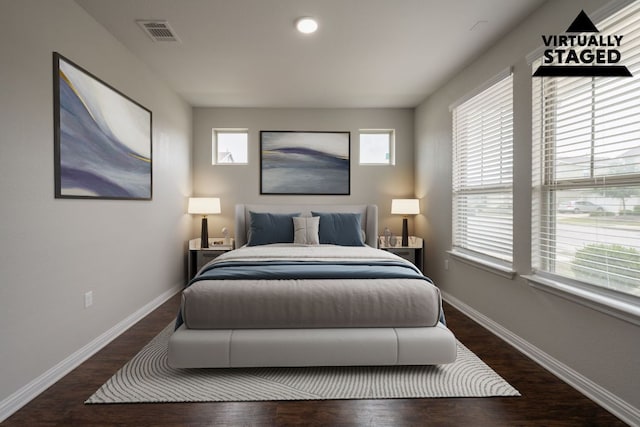 5817 Gerard Dr, Austin, TX 78744 - bedroom with wood finished floors, baseboards, and recessed lighting