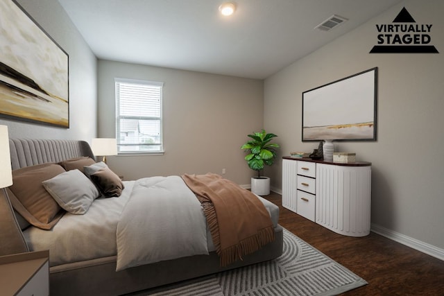 5817 Gerard Dr, Austin, TX 78744 - bedroom featuring baseboards and wood finished floors