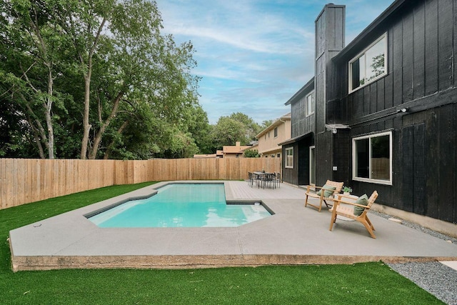 view of pool featuring a fenced in pool, a fenced backyard, and a patio area