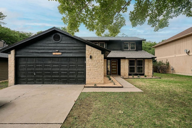 view of front of home featuring roof with shingles, an attached garage, stone siding, a front yard, and driveway