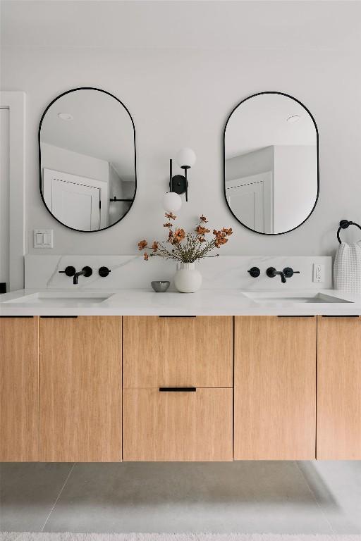 bathroom with double vanity and a sink