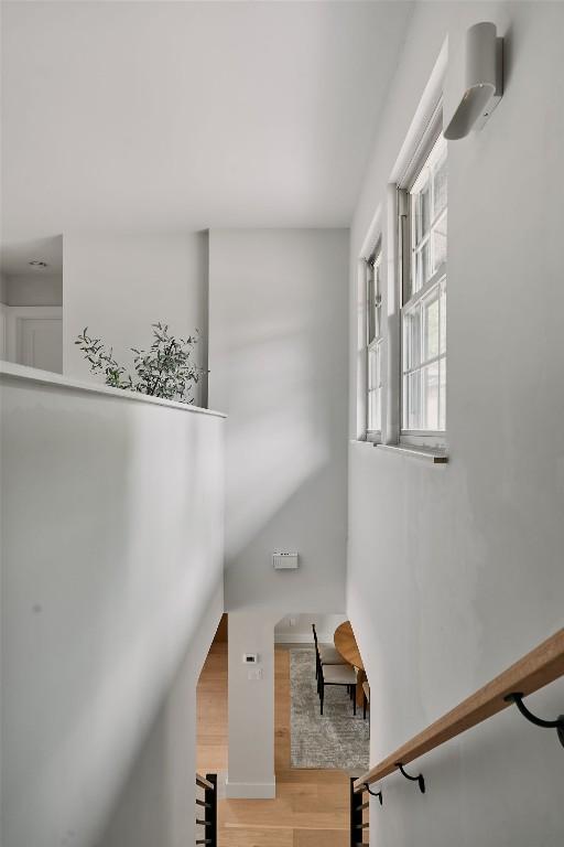 stairway with wood finished floors