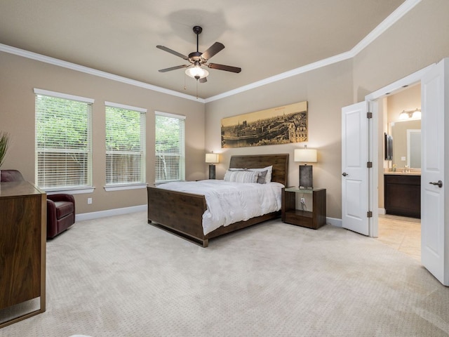 carpeted bedroom featuring crown molding, baseboards, ensuite bathroom, and a ceiling fan