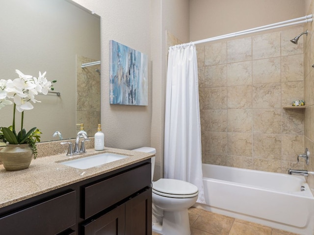 full bathroom with vanity, tile patterned flooring, toilet, and shower / tub combo