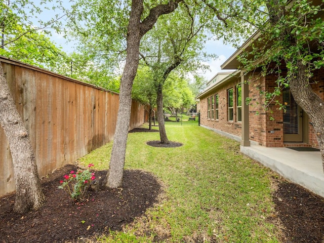 view of yard with a fenced backyard
