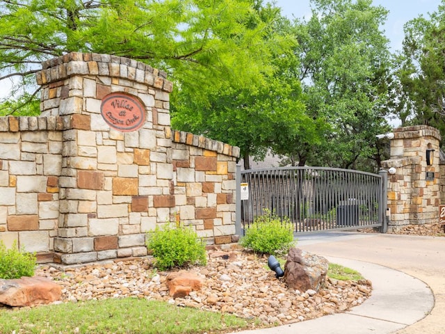 view of gate featuring fence