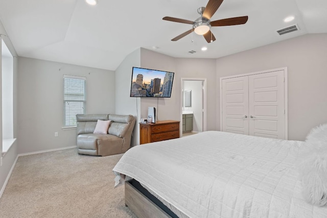 bedroom with visible vents, a closet, recessed lighting, carpet flooring, and vaulted ceiling