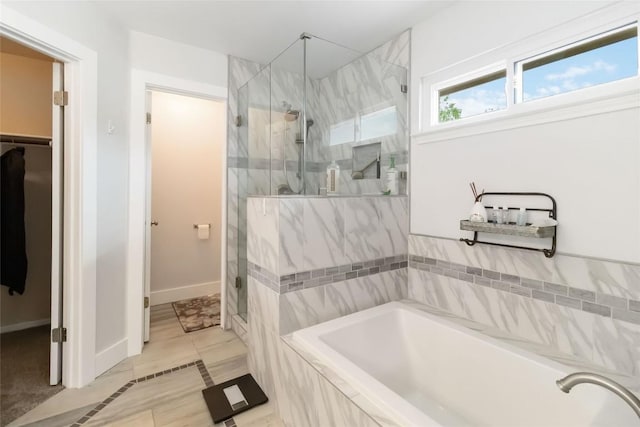 1400 Hargis Creek Trl, Austin, TX 78717 - full bath featuring a bath, a marble finish shower, a spacious closet, baseboards, and tile patterned floors