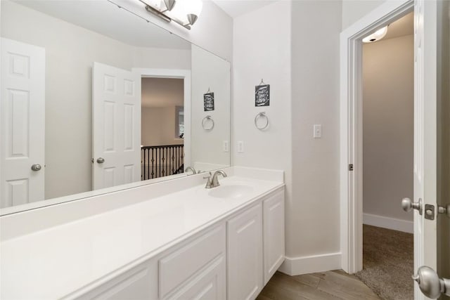 1400 Hargis Creek Trl, Austin, TX 78717 - bathroom with vanity, wood finished floors, and baseboards