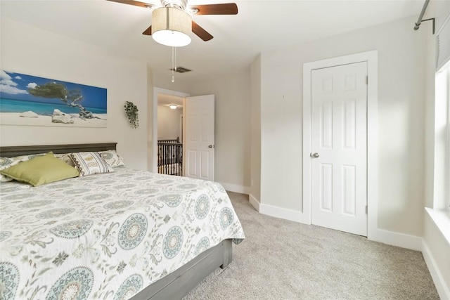 1400 Hargis Creek Trl, Austin, TX 78717 - bedroom with light colored carpet, baseboards, and ceiling fan