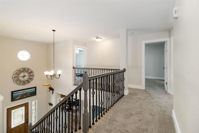 1400 Hargis Creek Trl, Austin, TX 78717 - hallway featuring an upstairs landing, carpet, a chandelier, and baseboards