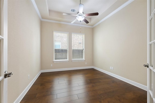 empty room with ceiling fan, ornamental molding, and dark wood-style floors