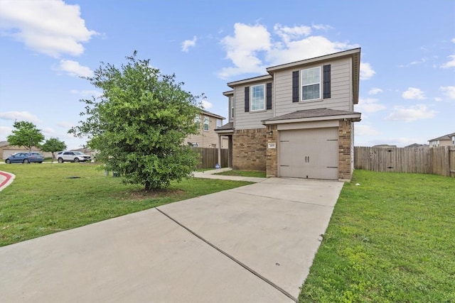 traditional-style house featuring fence, a front yard, driveway, and a garage