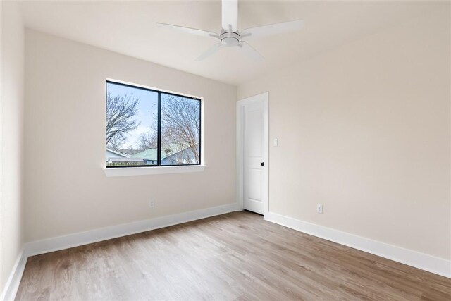 927 Peggotty Pl, Austin, TX 78753 - unfurnished room with wood finished floors and a ceiling fan