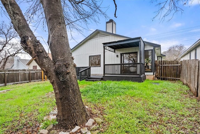 927 Peggotty Pl, Austin, TX 78753 - rear view of house with a deck and a chimney