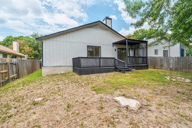 927 Peggotty Pl, Austin, TX 78753 - rear view of house featuring a chimney, a fenced backyard, and a wooden deck
