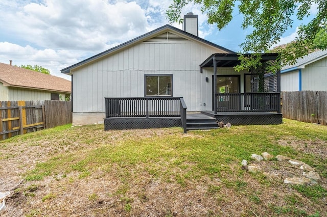 927 Peggotty Pl, Austin, TX 78753 - rear view of house featuring a fenced backyard, a deck, and a chimney