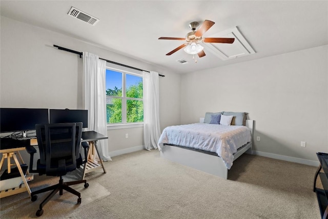 bedroom with visible vents, attic access, baseboards, and carpet