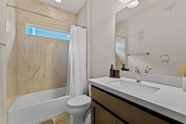 full bath with tile patterned flooring, shower / bath combination with curtain, toilet, and vanity