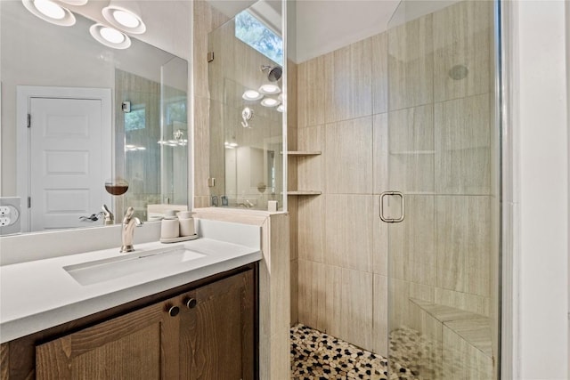 bathroom with vanity and a stall shower