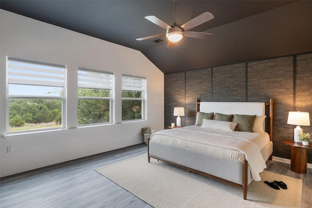 16720 Horondelle Dr, Austin, TX 78738 - bedroom featuring wood finished floors, lofted ceiling, and a ceiling fan